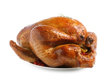 Photo of Whole baked turkey with cranberries and rosemary isolated on white