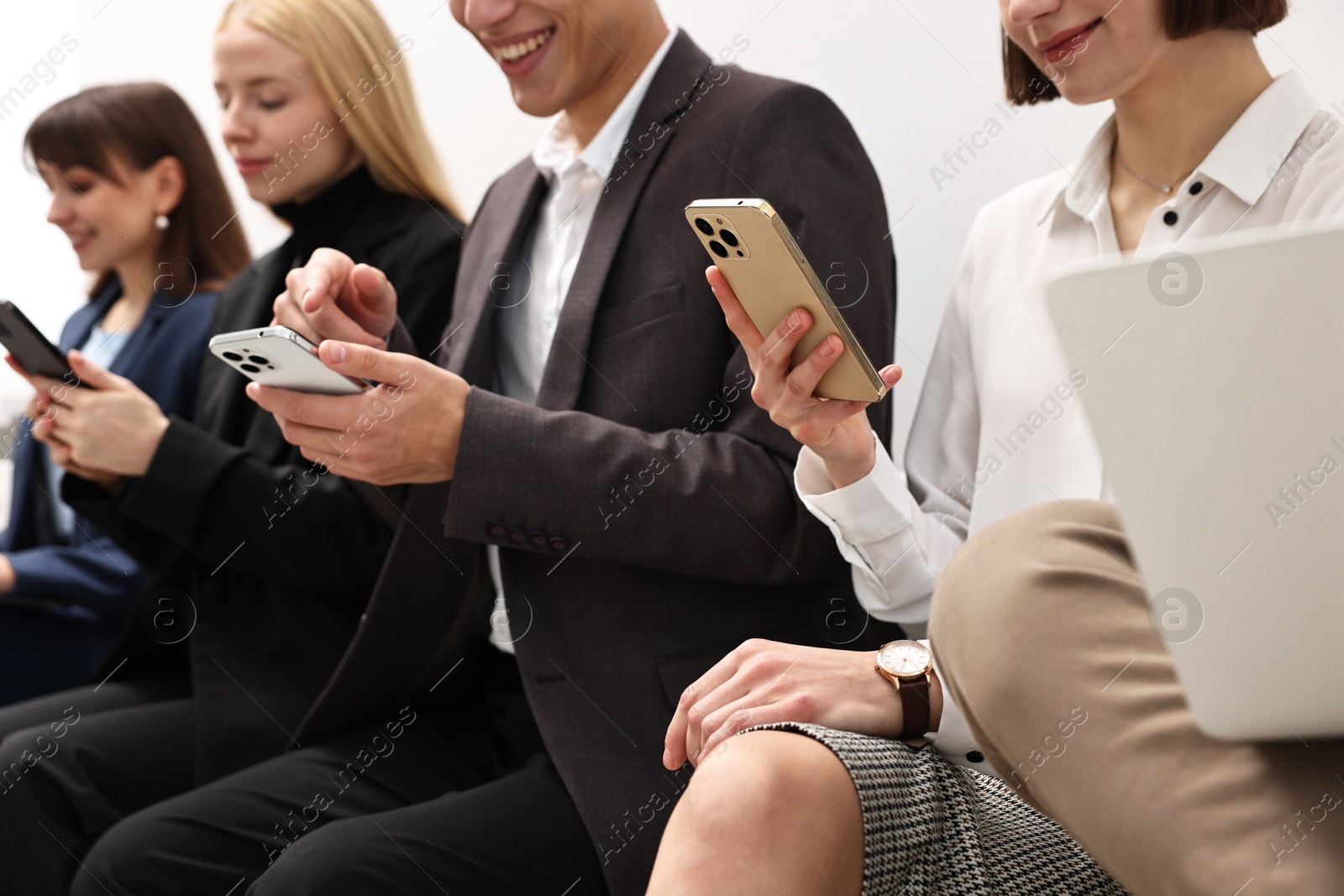 Photo of Group of people using different gadgets indoors, closeup. Modern technology