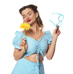 Photo of Attractive pin-up woman with flower and glasses on white background