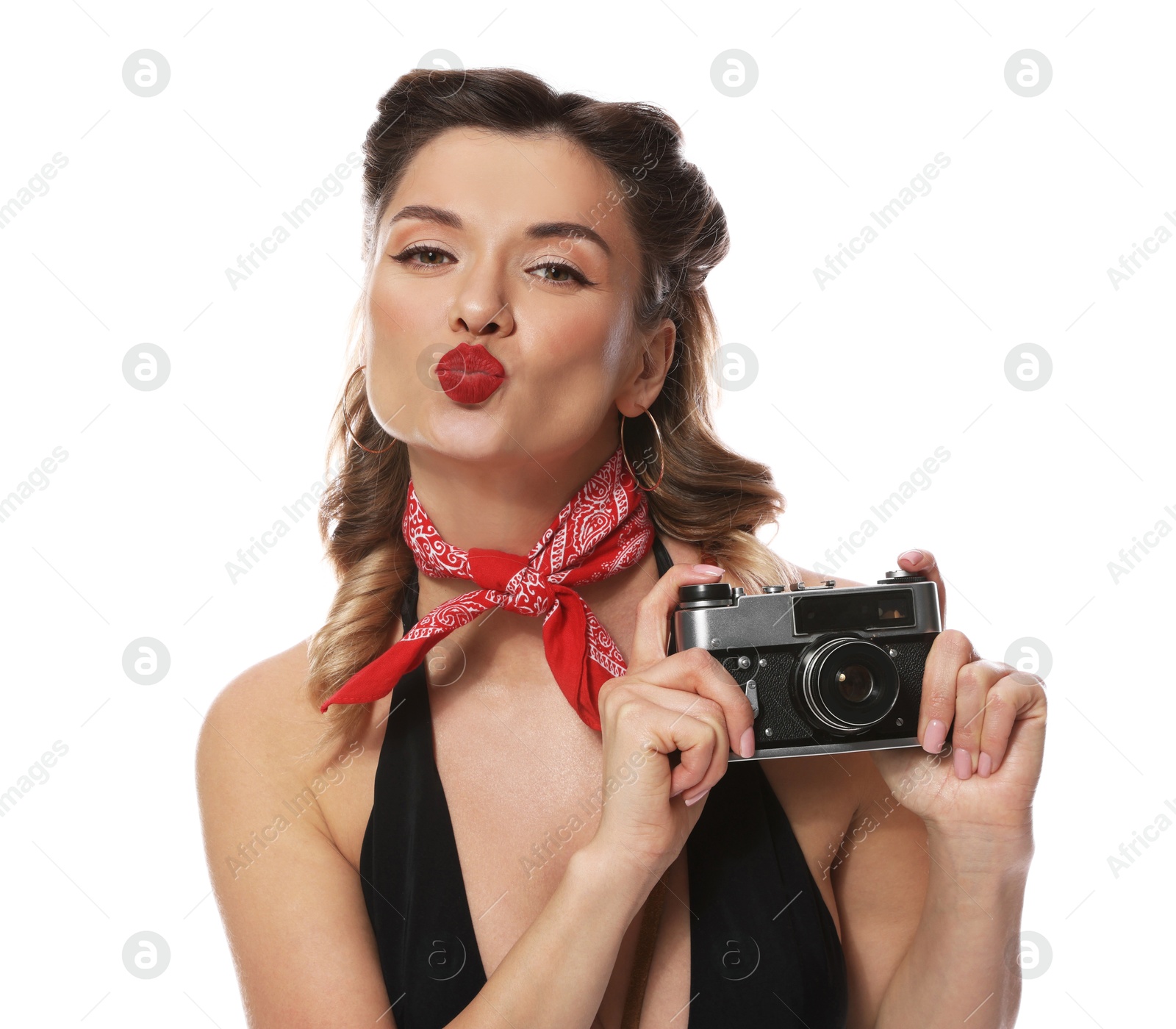 Photo of Attractive pin-up woman with vintage camera on white background