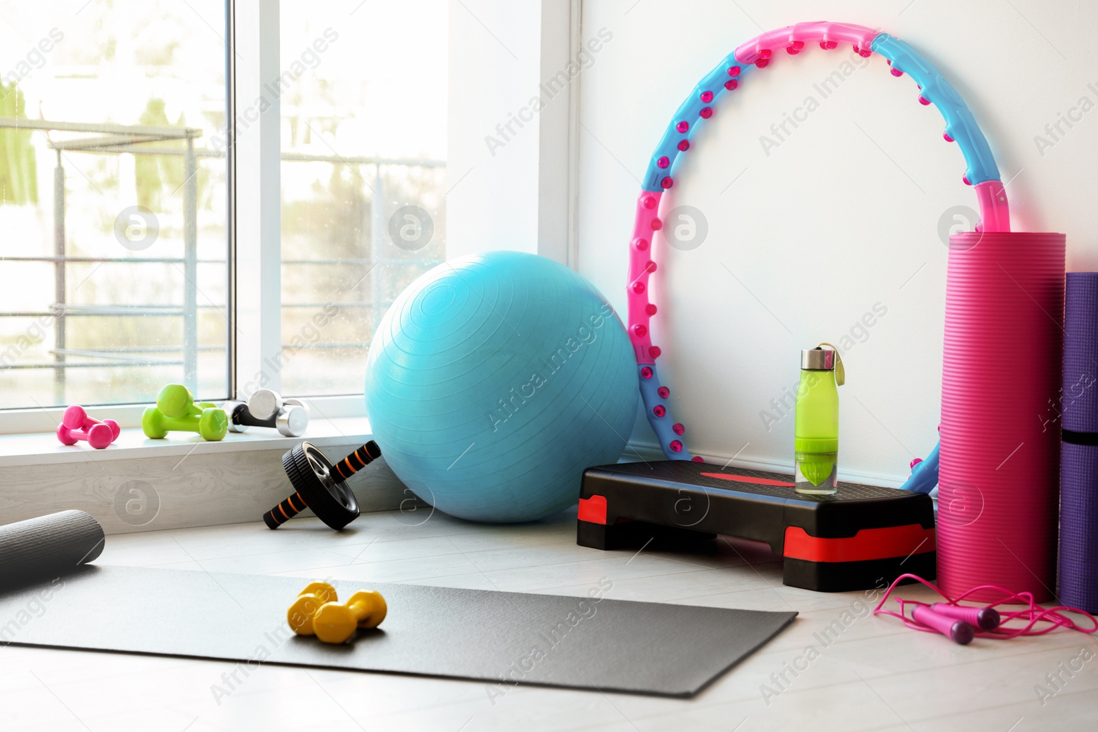 Photo of Many different fitness equipment and accessories indoors