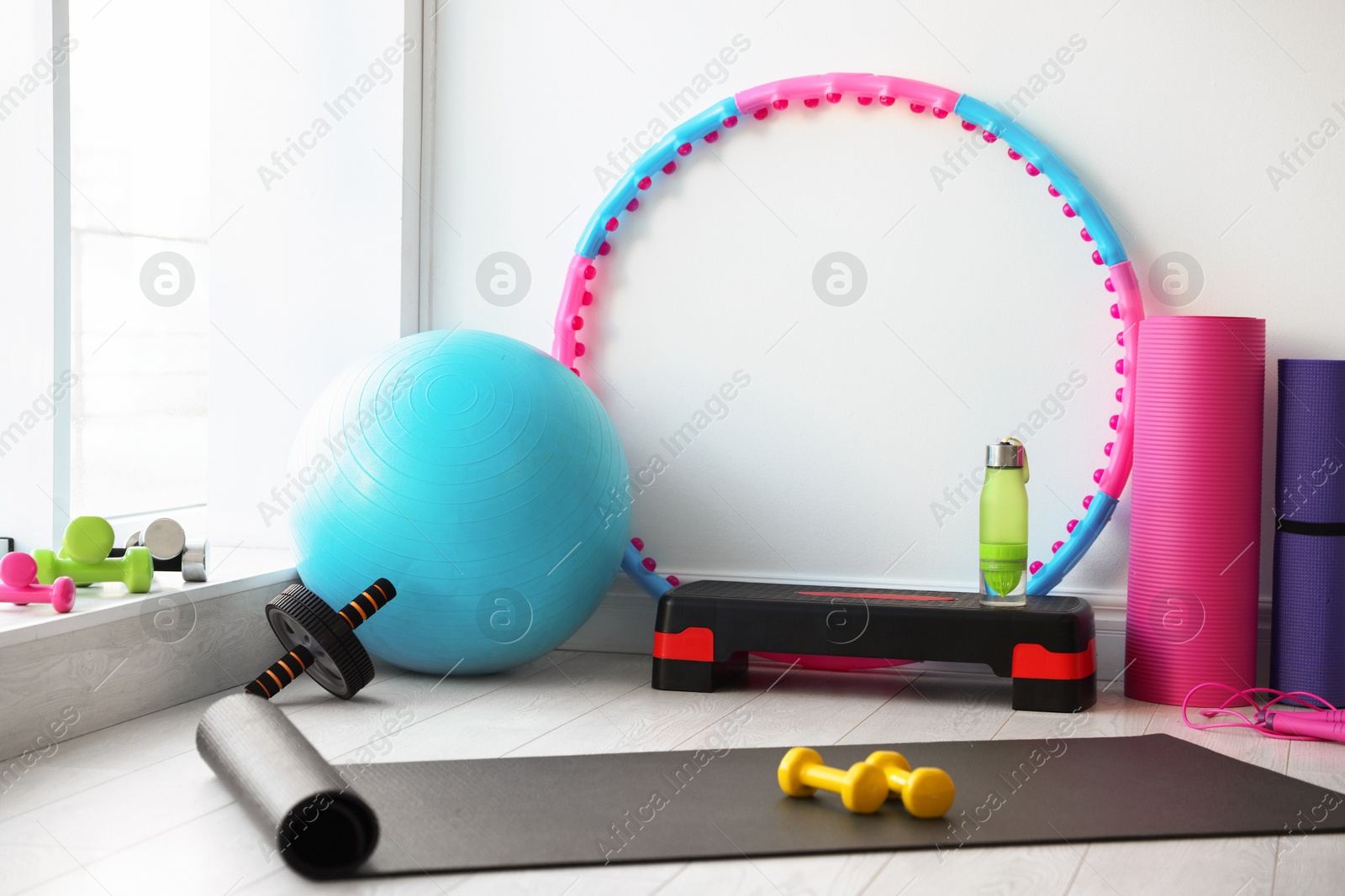 Photo of Many different fitness equipment and accessories indoors