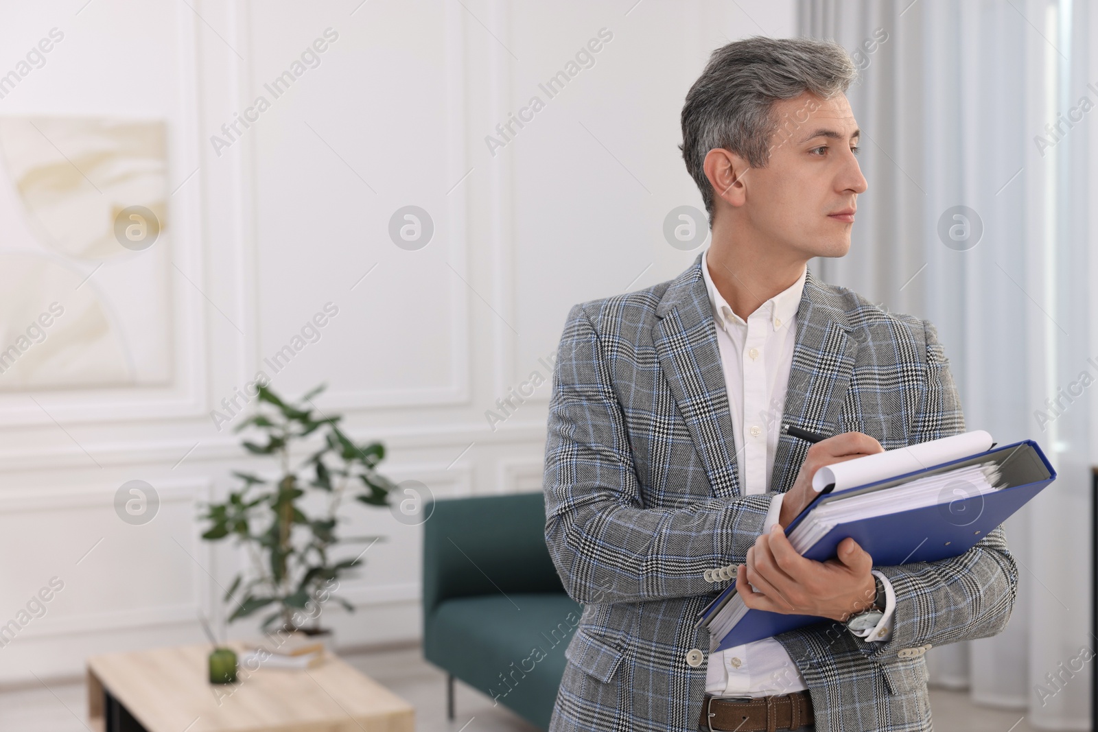 Photo of Real estate appraisal. Inspector with clipboard conducting property valuation at home. Space for text