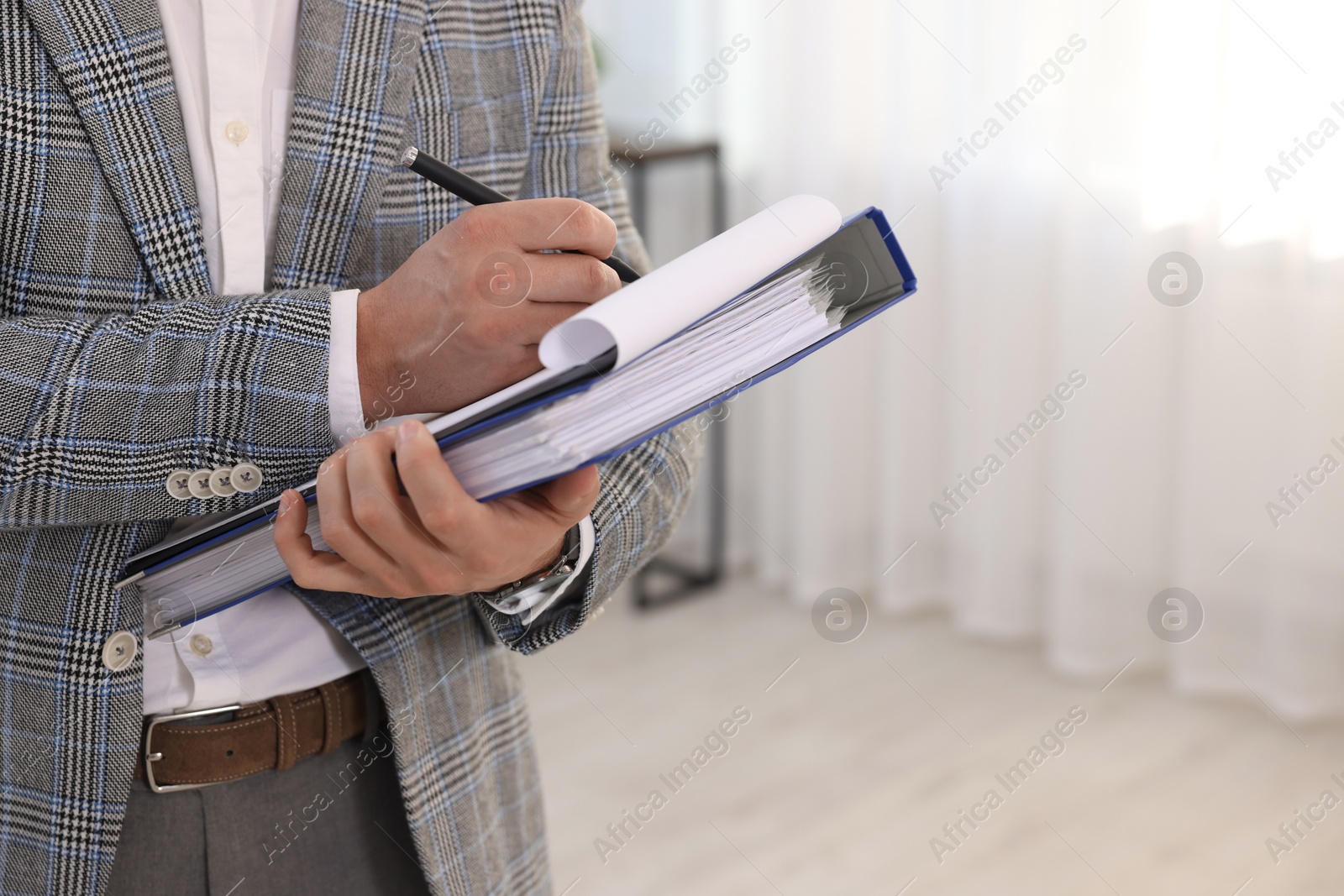 Photo of Real estate appraisal. Inspector with clipboard conducting property valuation at home, closeup