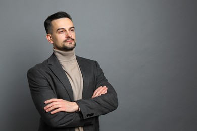 Photo of Portrait of handsome middle aged man on grey background, space for text