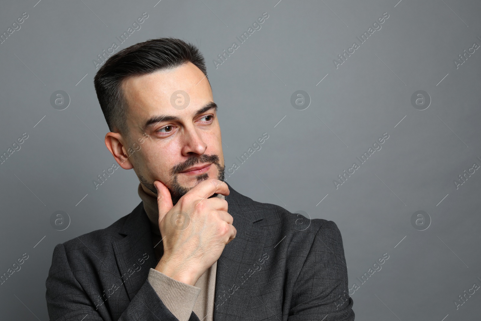 Photo of Portrait of handsome middle aged man on grey background, space for text