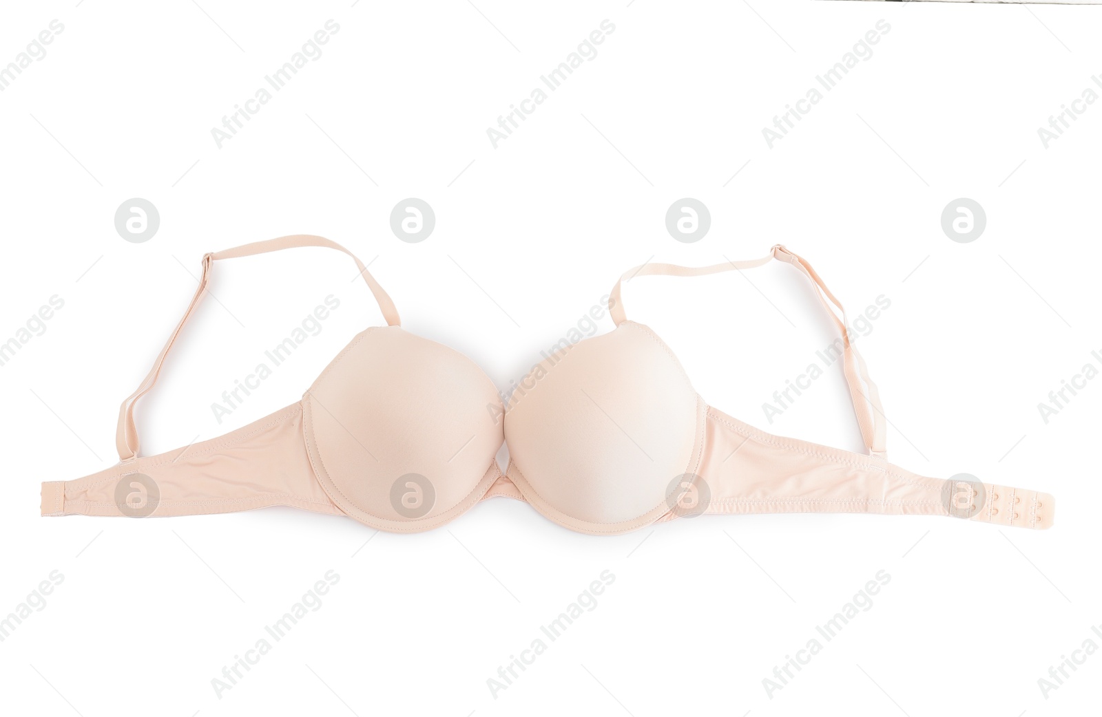 Photo of Beautiful beige bra isolated on white, top view