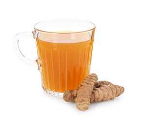 Photo of Aromatic turmeric tea in glass cup and roots isolated on white