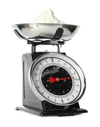 Photo of Retro mechanical kitchen scale with flour isolated on white