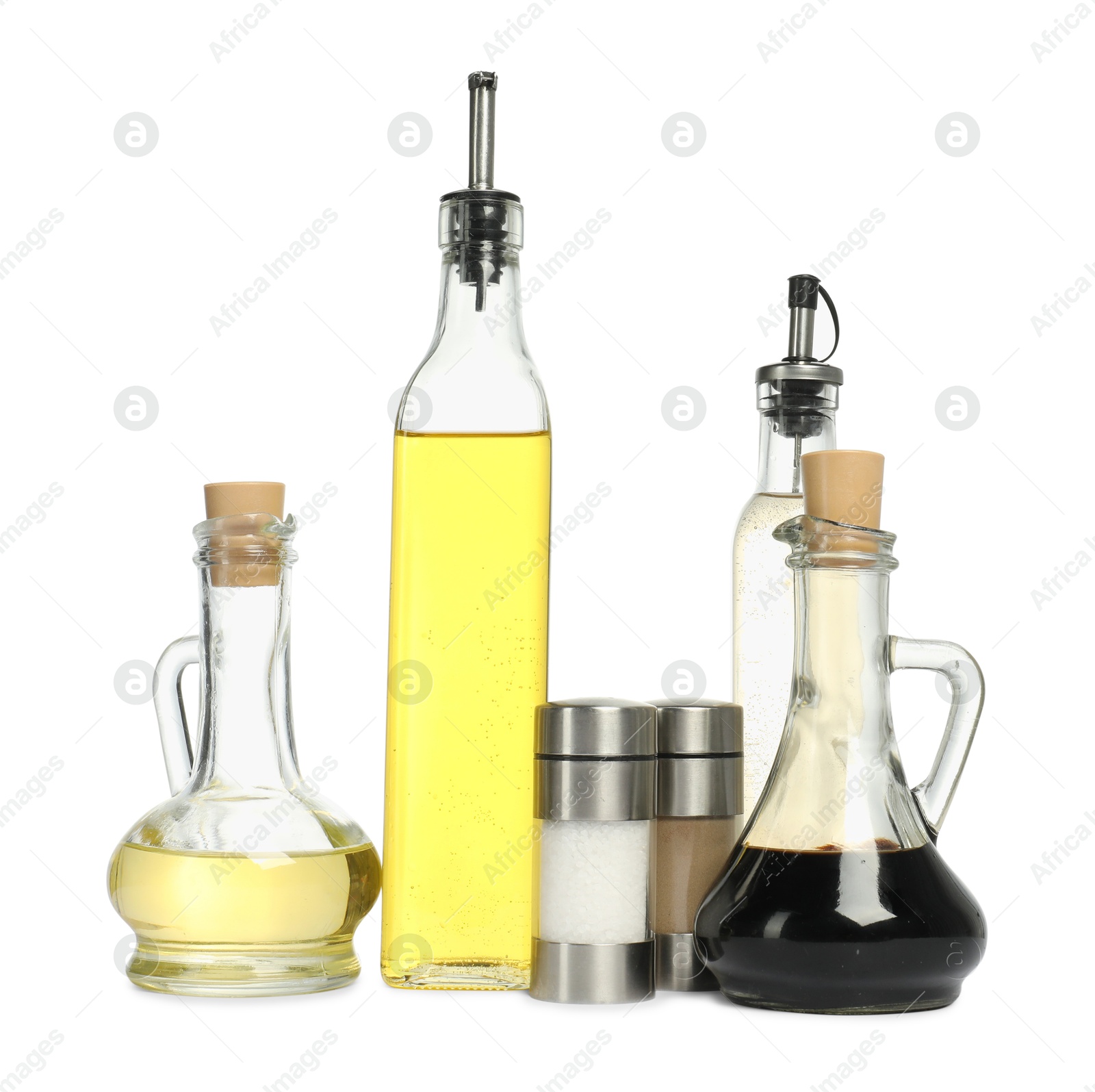 Photo of Salad dressings and spices isolated on white