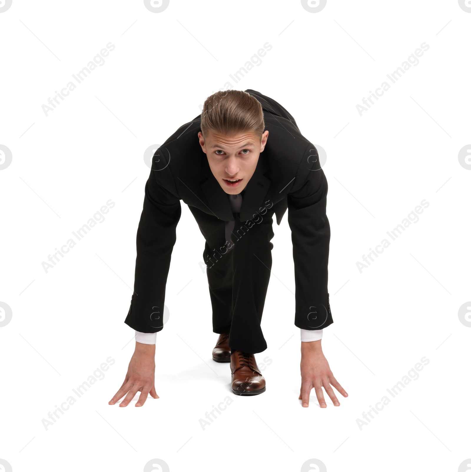 Photo of Businessman in starting position for run ready for competition on white background