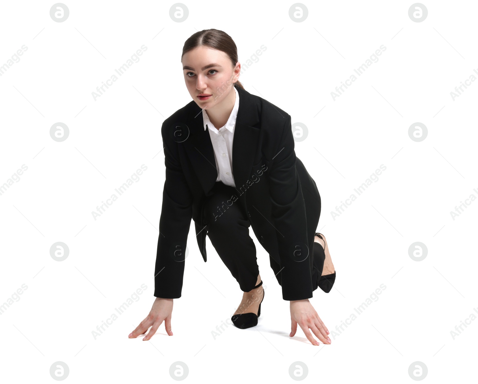 Photo of Businesswoman in starting position for run ready for competition on white background