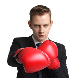 Photo of Competition. Businessman in suit wearing boxing gloves on white background