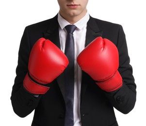 Photo of Competition. Businessman in suit wearing boxing gloves on white background, closeup