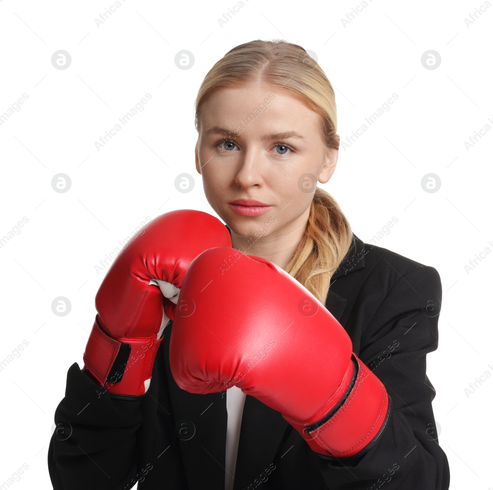 Photo of Competition. Businesswoman in suit wearing boxing gloves on white background