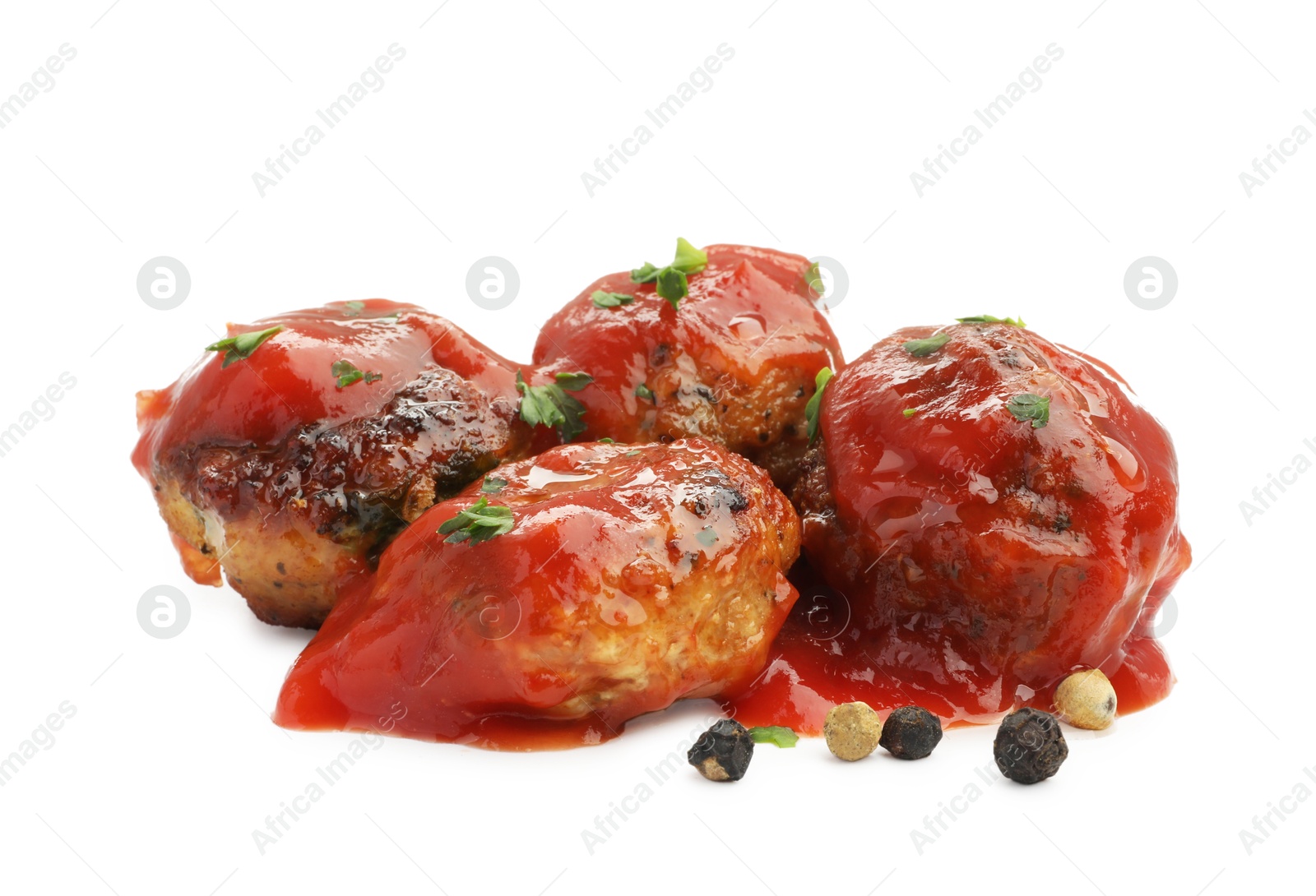 Photo of Delicious meatballs with tomato sauce and spices isolated on white