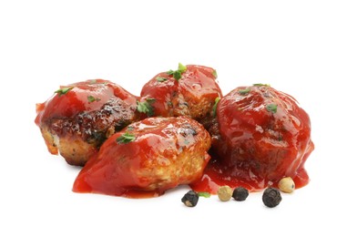 Photo of Delicious meatballs with tomato sauce and spices isolated on white