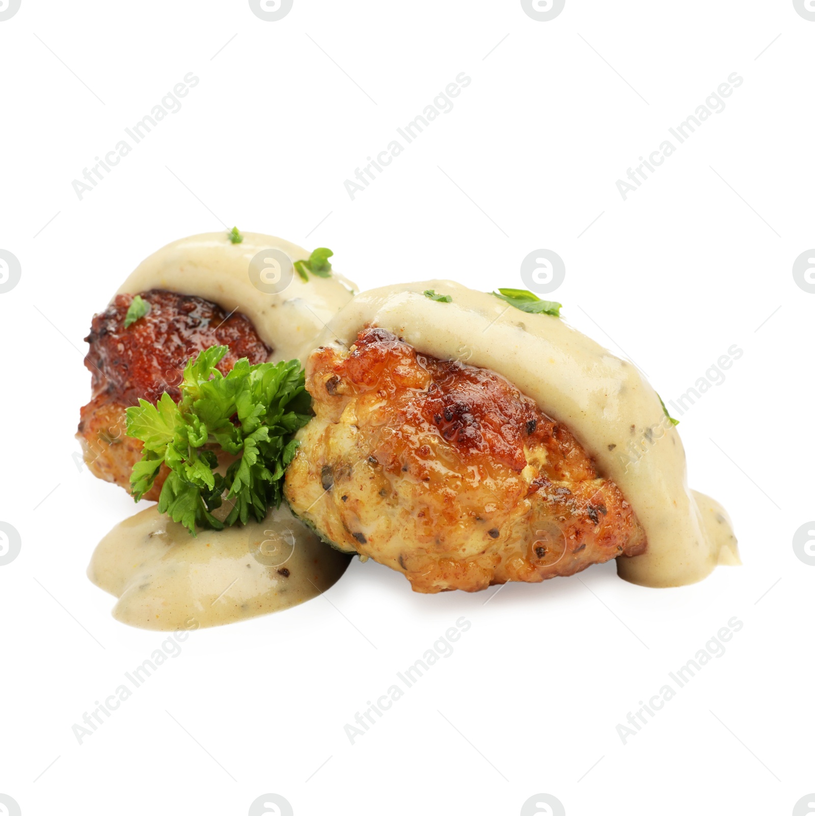 Photo of Delicious meatballs with creamy sauce isolated on white