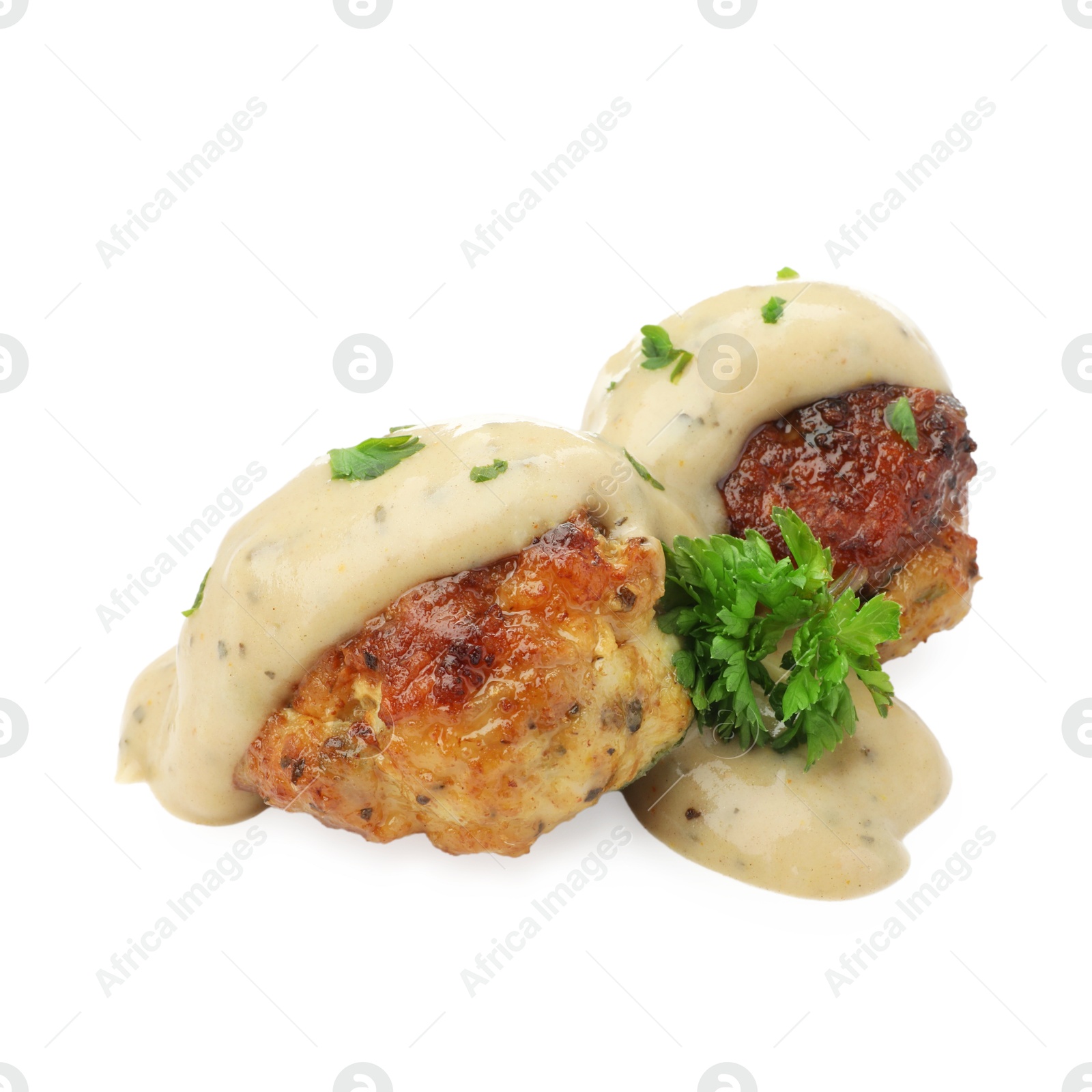 Photo of Delicious meatballs with creamy sauce isolated on white