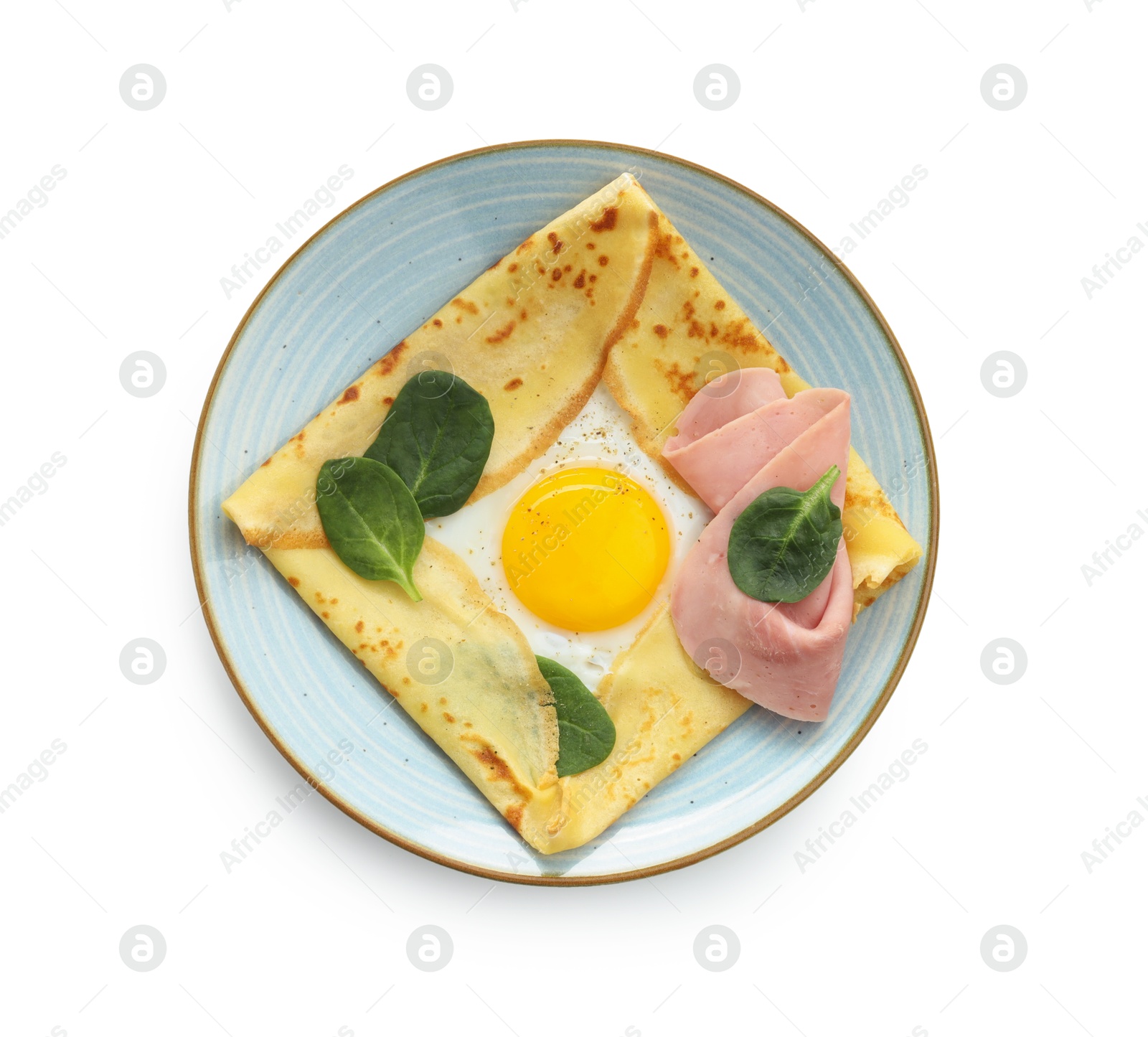 Photo of Delicious crepe with egg, ham and basil isolated on white, top view