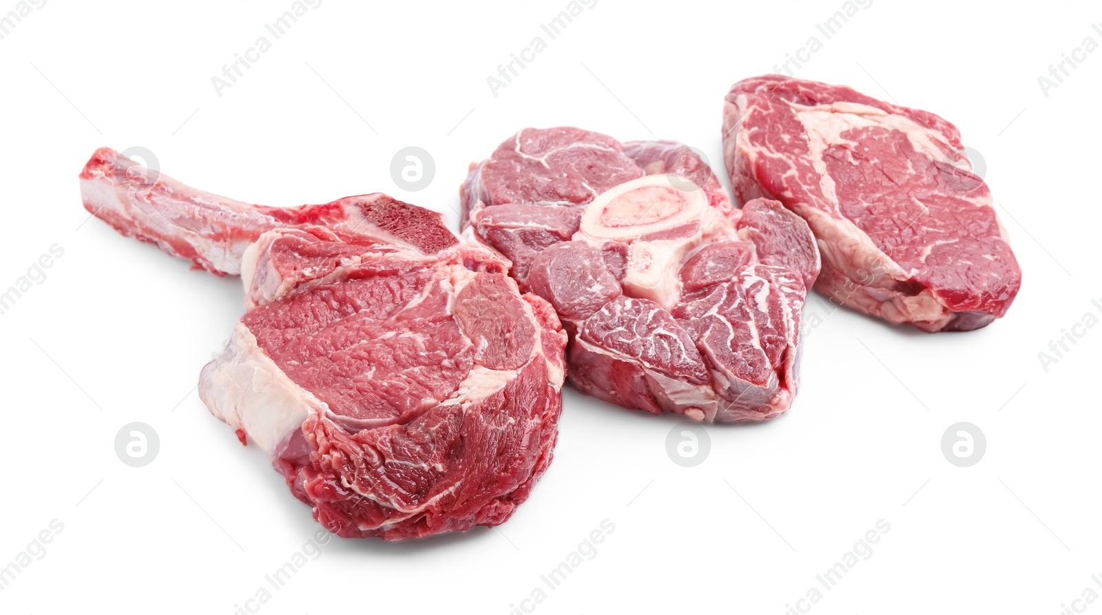 Photo of Pieces of raw beef meat isolated on white