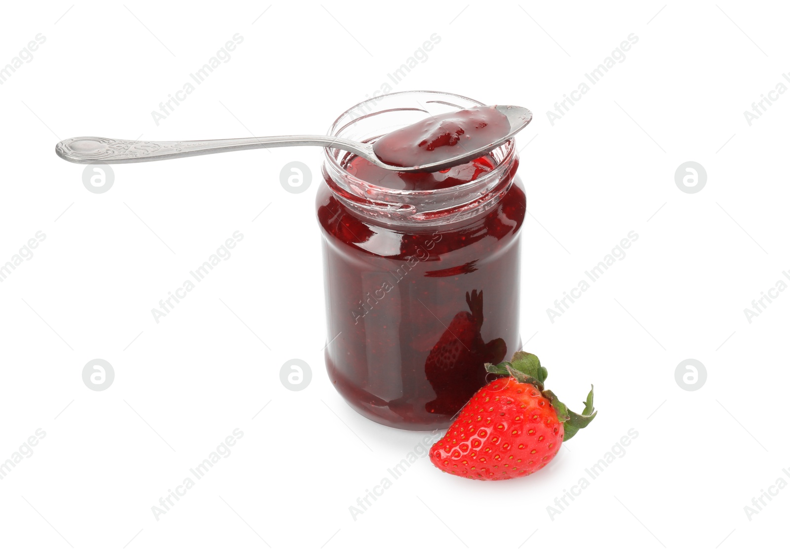 Photo of Tasty strawberry sauce in jar with spoon and fresh berry isolated on white