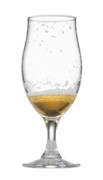 Photo of Almost empty glass of beer isolated on white