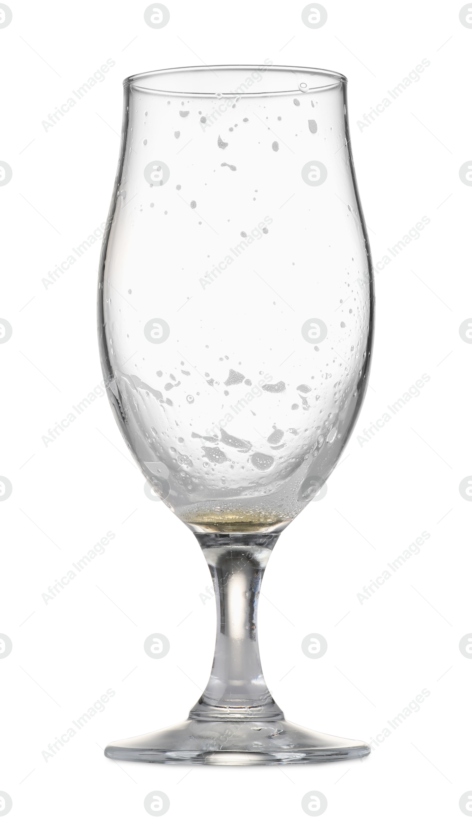 Photo of Almost empty glass of beer isolated on white