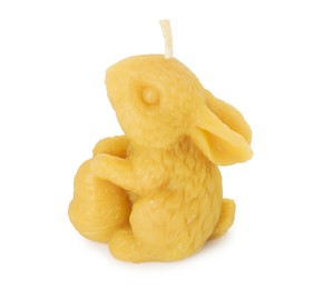 Photo of Yellow bunny-shaped candle isolated on white. Easter decor