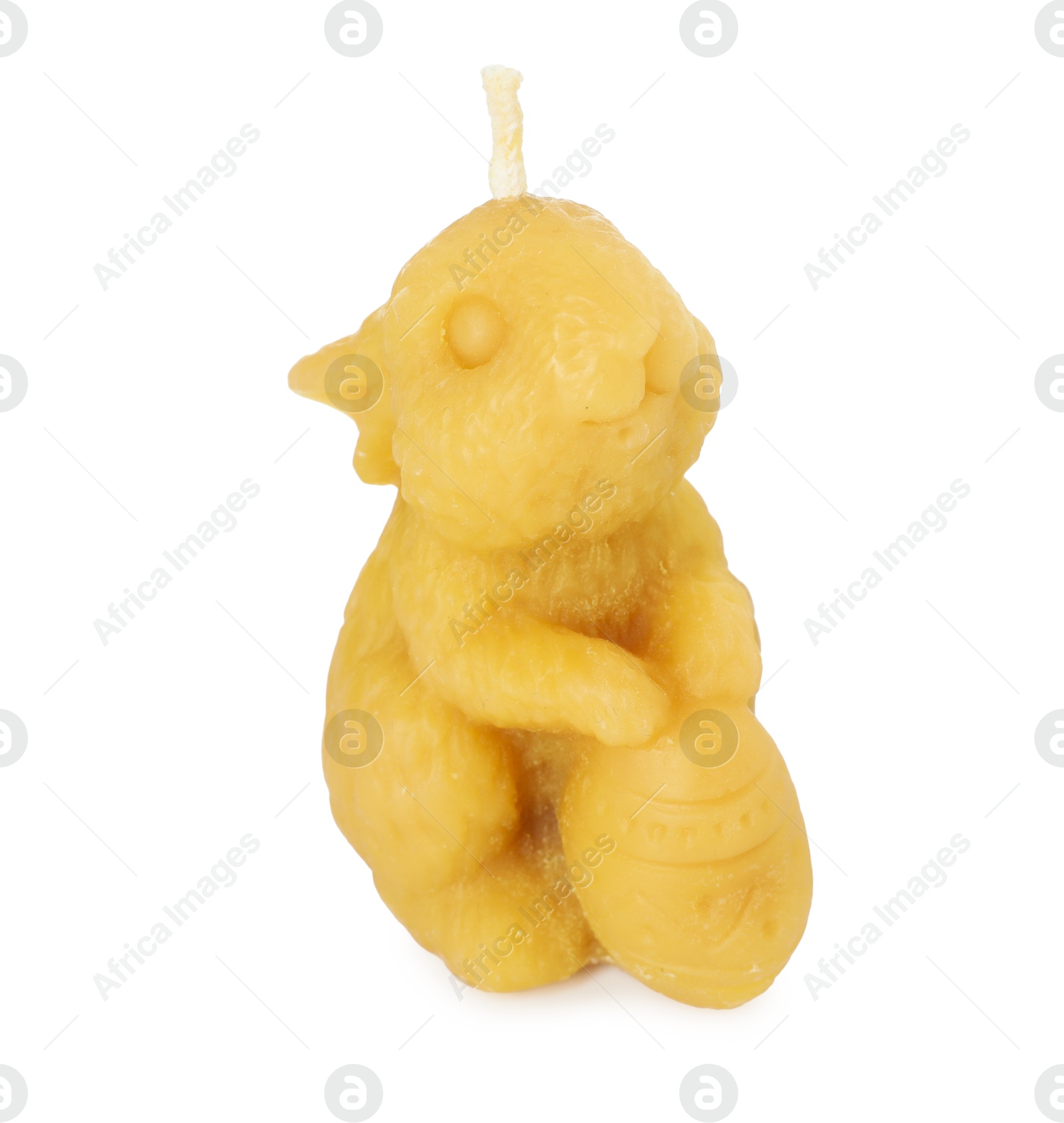 Photo of Yellow bunny-shaped candle isolated on white. Easter decor