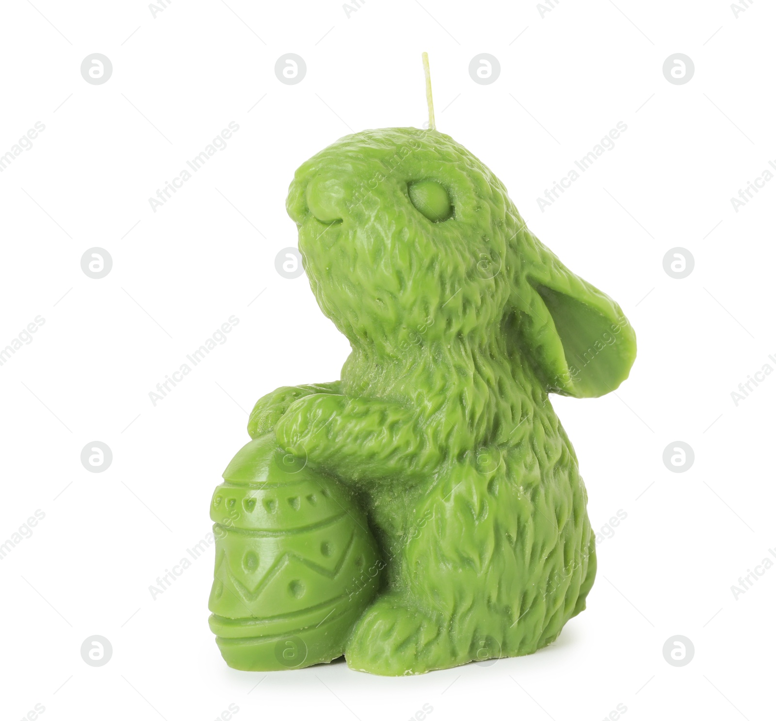 Photo of Green bunny-shaped candle isolated on white. Easter decor