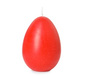 Photo of Red egg-shaped candle isolated on white. Easter decor