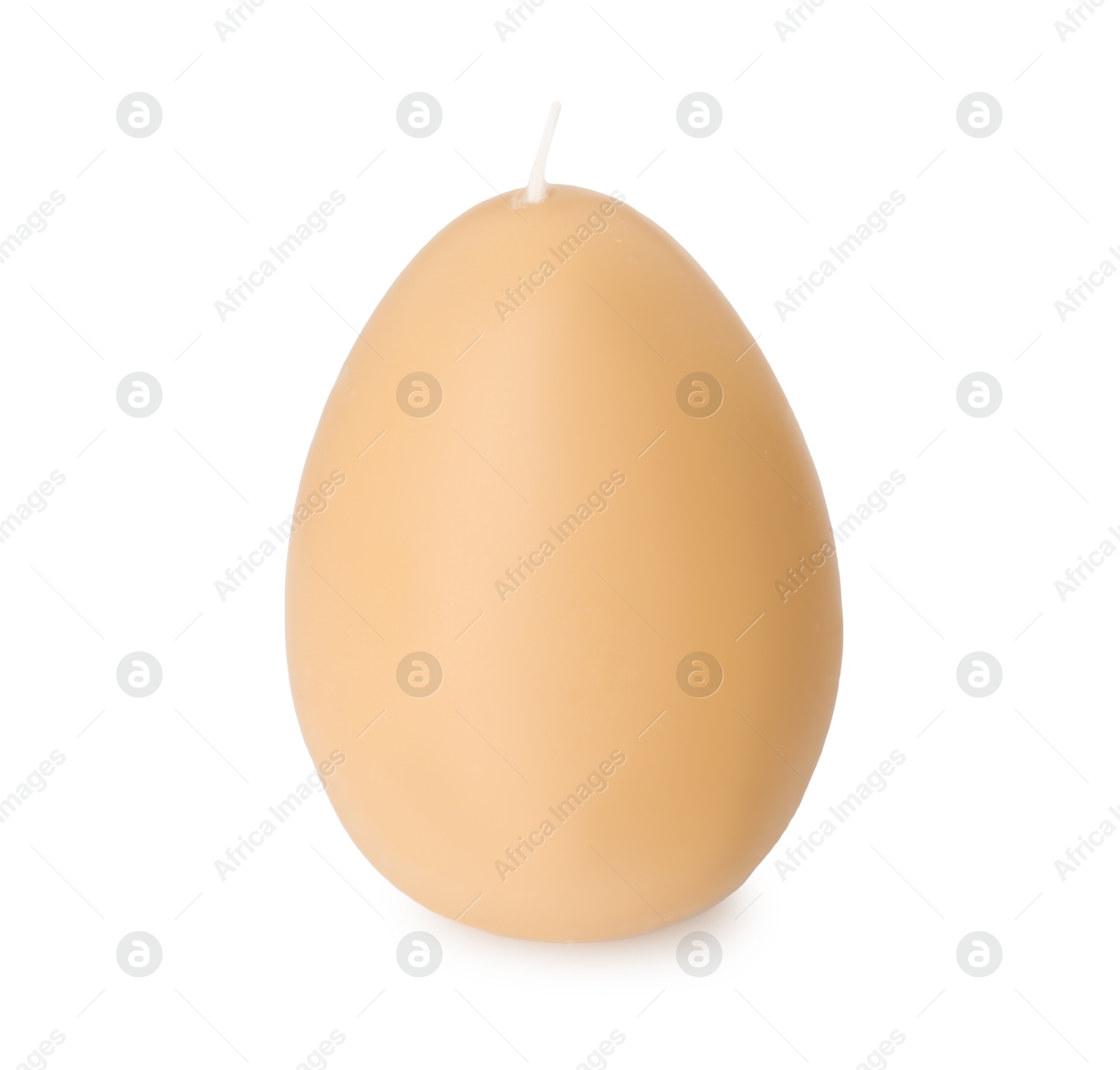 Photo of Egg-shaped candle isolated on white. Easter decor