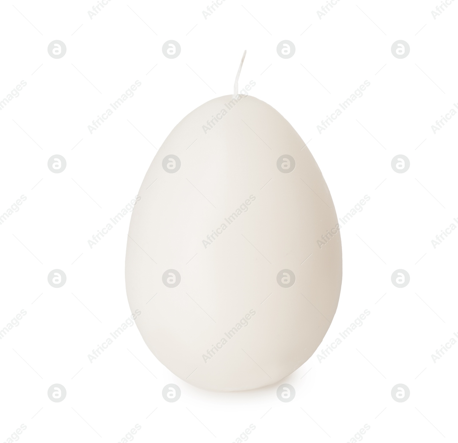 Egg-shaped candle isolated on white. Easter decor Photo of Egg-shaped candle isolated on white. Easter decor