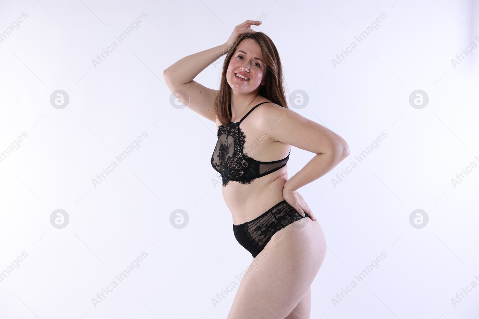 Photo of Woman in underwear on white background. Cellulite problem