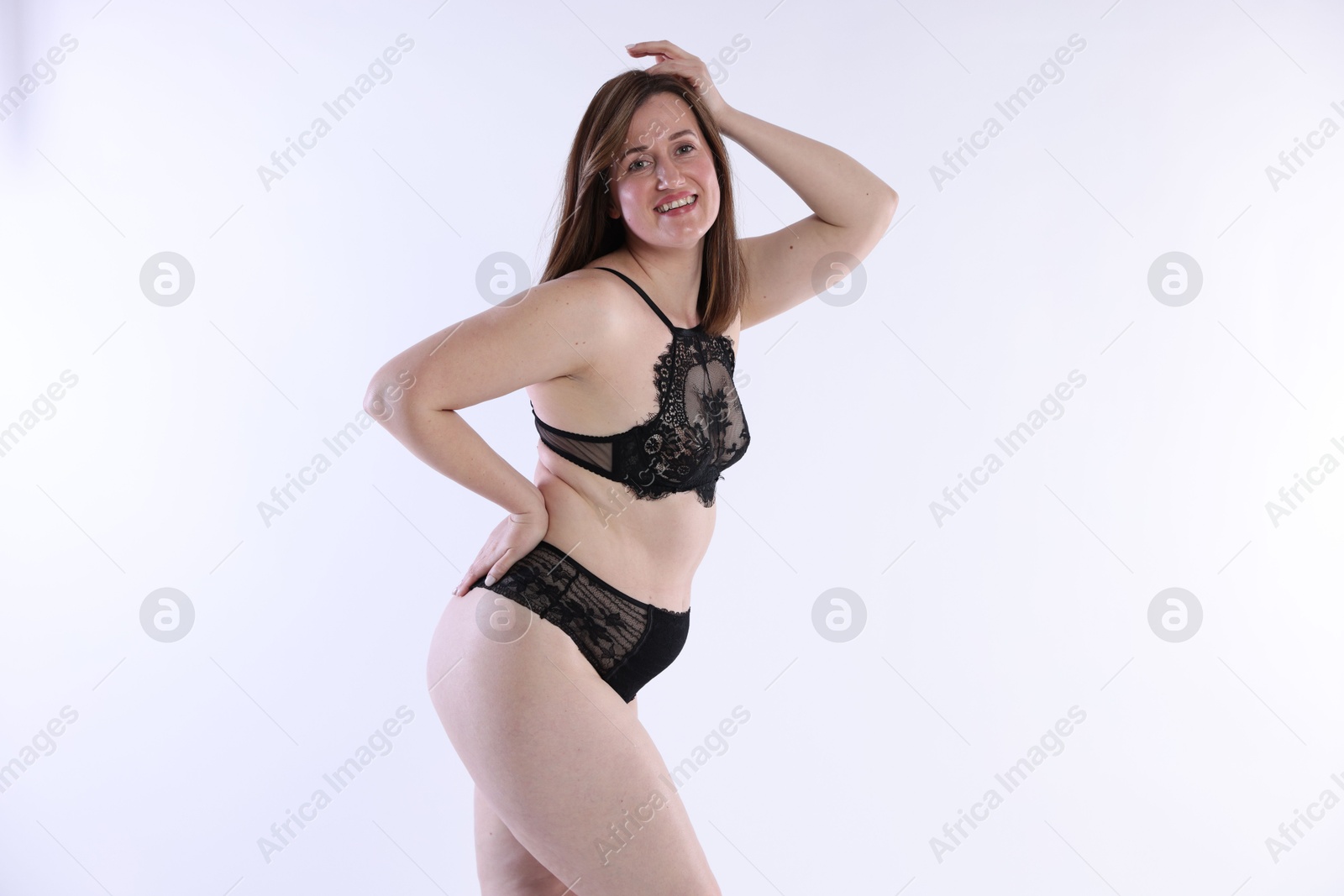 Photo of Woman in underwear on white background. Cellulite problem