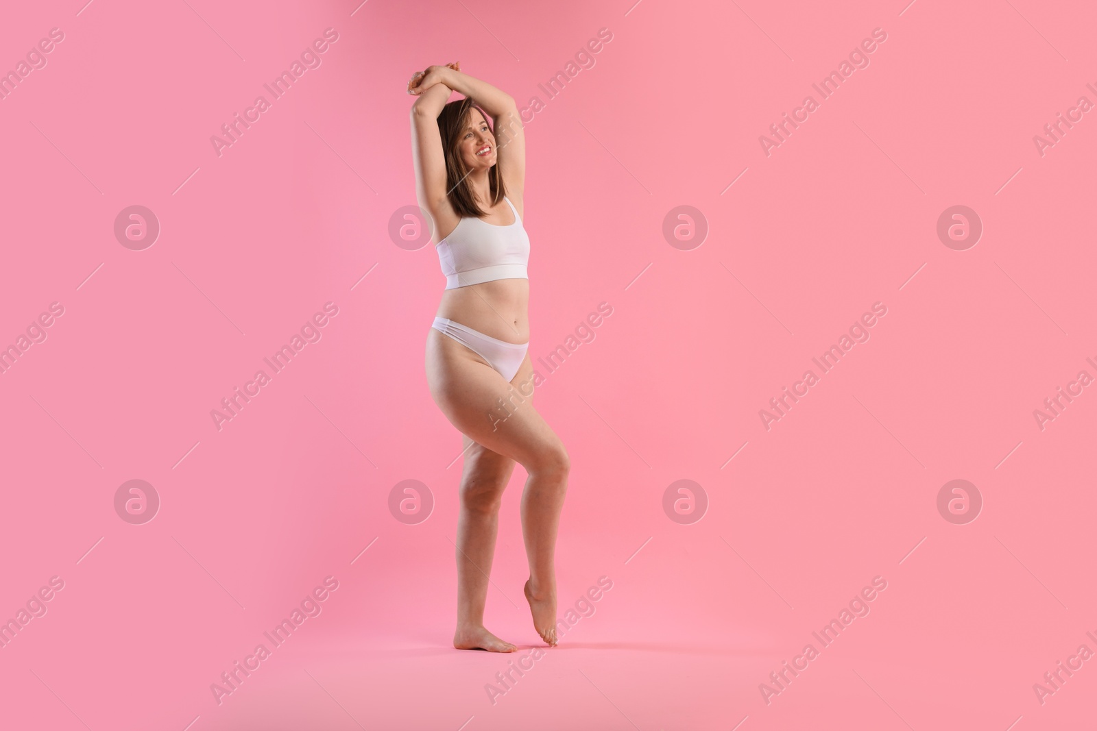 Photo of Woman in underwear on pink background, space for text. Cellulite problem