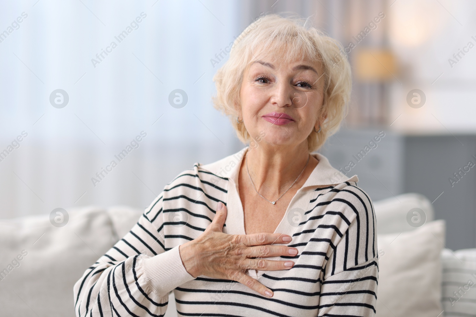 Photo of Portrait of grandmother with beautiful makeup at home