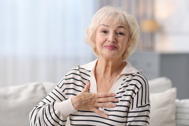 Portrait of grandmother with beautiful makeup at home