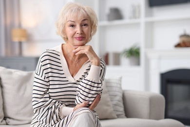 Photo of Portrait of beautiful grandmother at home. Space for text