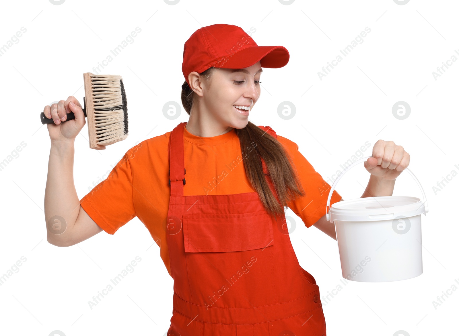 Photo of Professional painter with brush and bucket of paint on white background