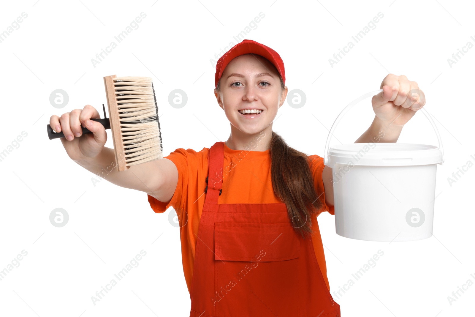 Photo of Professional painter with brush and bucket of paint on white background