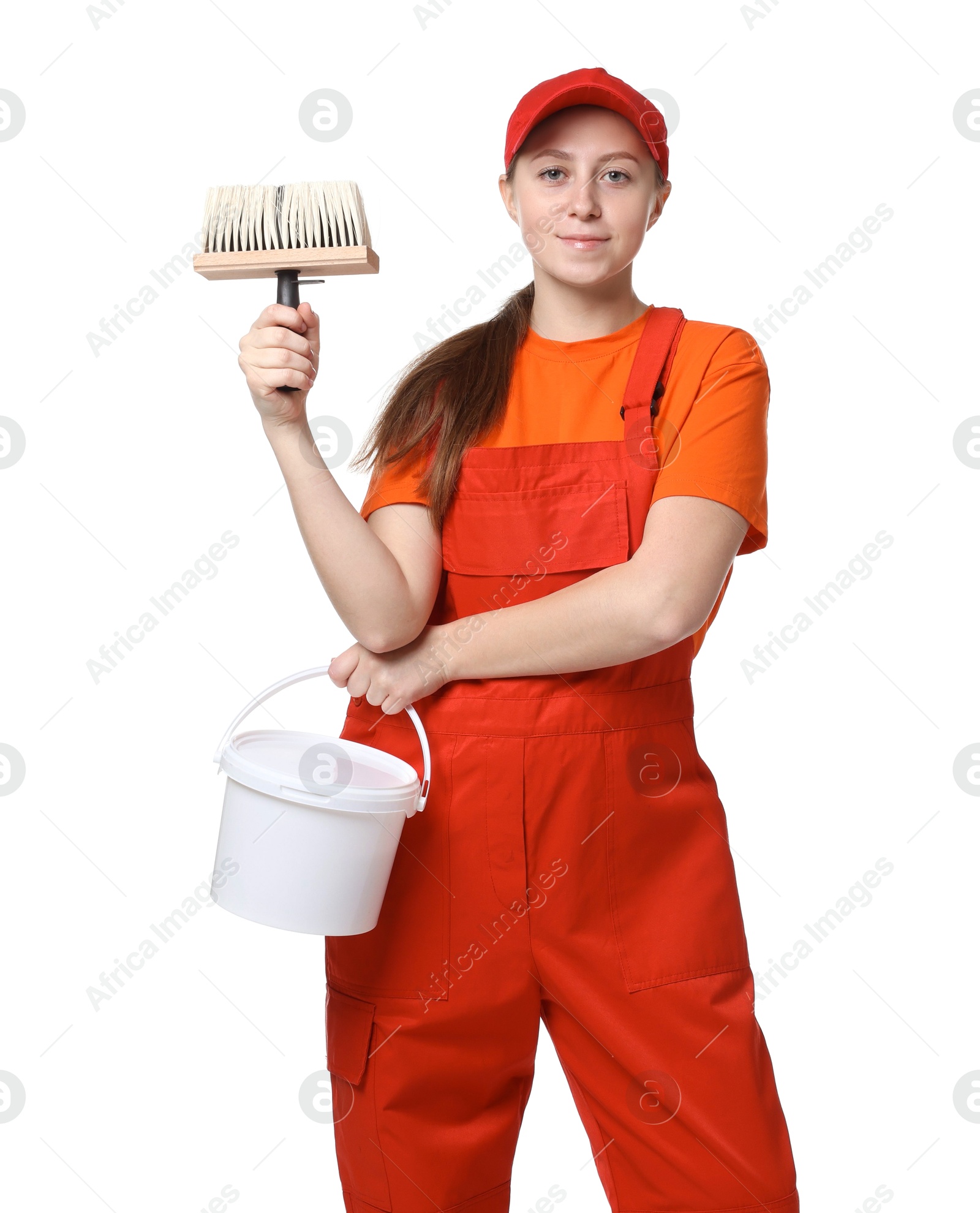 Photo of Professional painter with brush and bucket of paint on white background