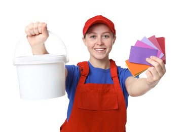 Photo of Professional painter with color samples and bucket of paint on white background