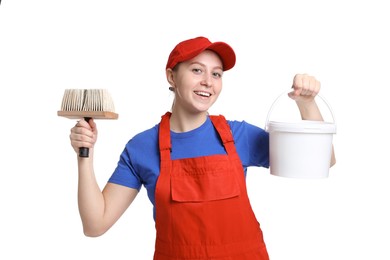 Photo of Professional painter with brush and bucket of paint on white background