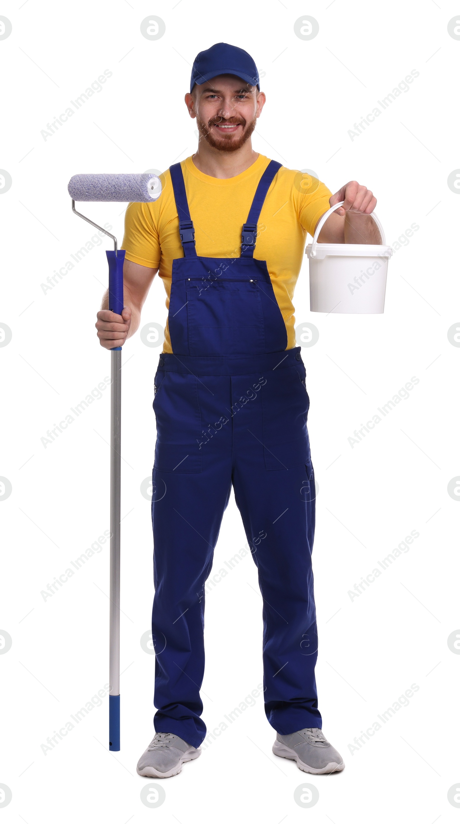 Photo of Professional painter with roller and bucket of paint on white background