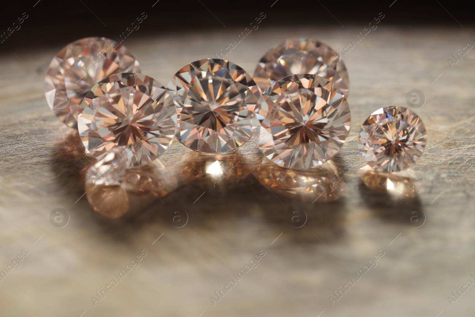 Photo of Beautiful shiny gemstones on metal tray, closeup