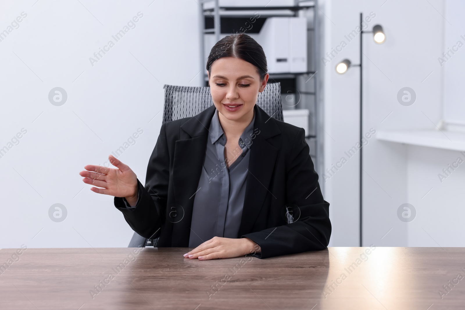 Photo of Beautiful woman looking at something in office