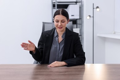 Photo of Beautiful woman looking at something in office