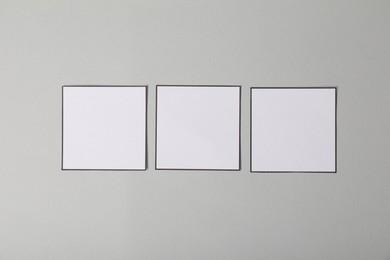 Photo of Empty checkboxes on grey background, flat lay